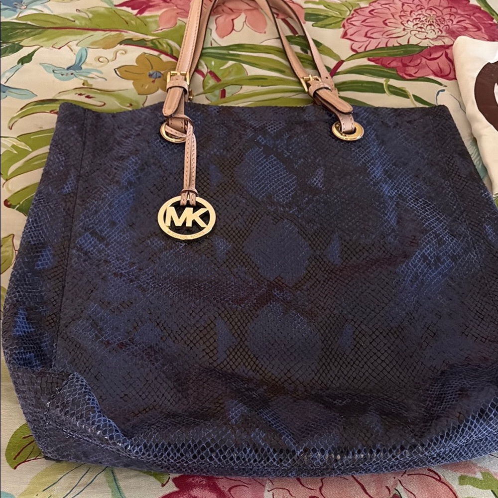 Adorable Royal blue Michael Kors satchel. Measures 16” x 16”.